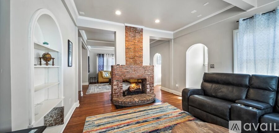 A living room with a fireplace and a couch.