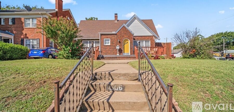 A house with a yellow door is for sale.