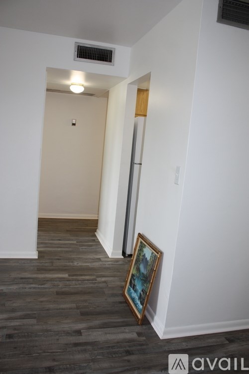 A bathroom with yellow walls and a window.