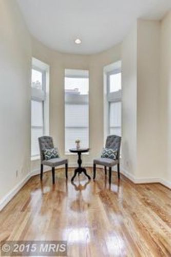 A room with a table and two chairs.