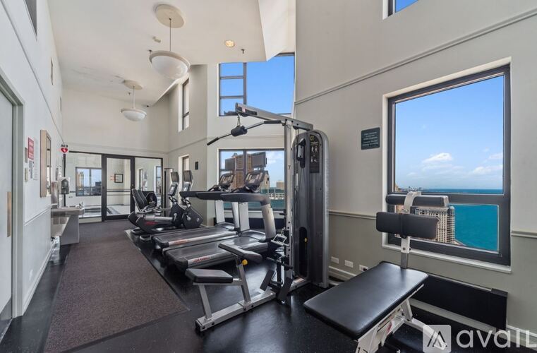 A gym with a view of the ocean.
