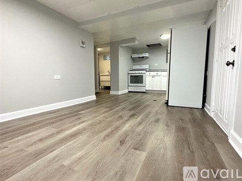 A kitchen area with a microwave, oven, and refrigerator.