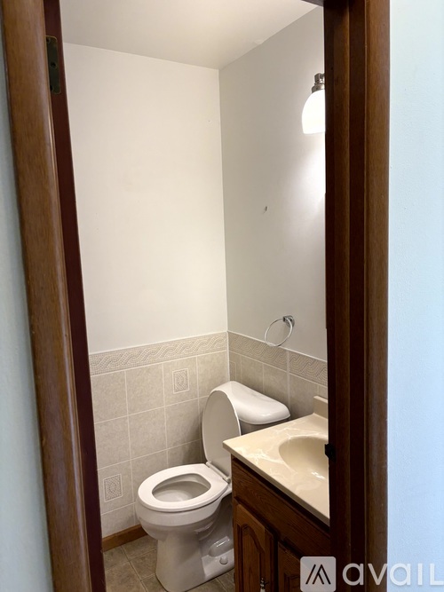 A small bathroom with a toilet and sink.