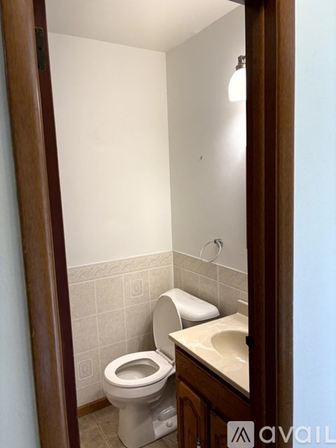 A small bathroom with a toilet and sink.
