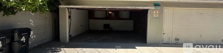 A white garage door with a sign on it.