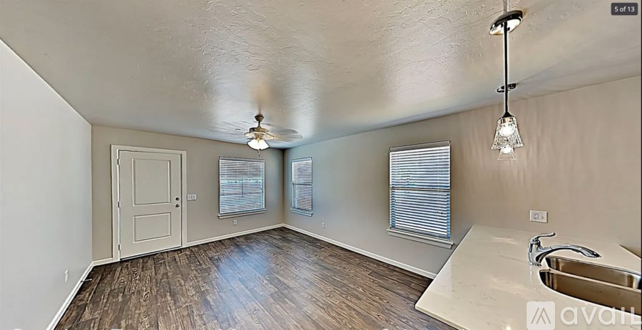 A room with a sink and a door.