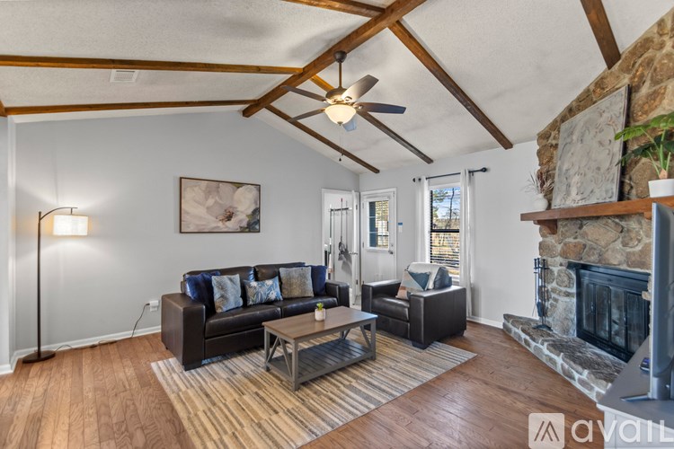 A living room with a fireplace and a couch.