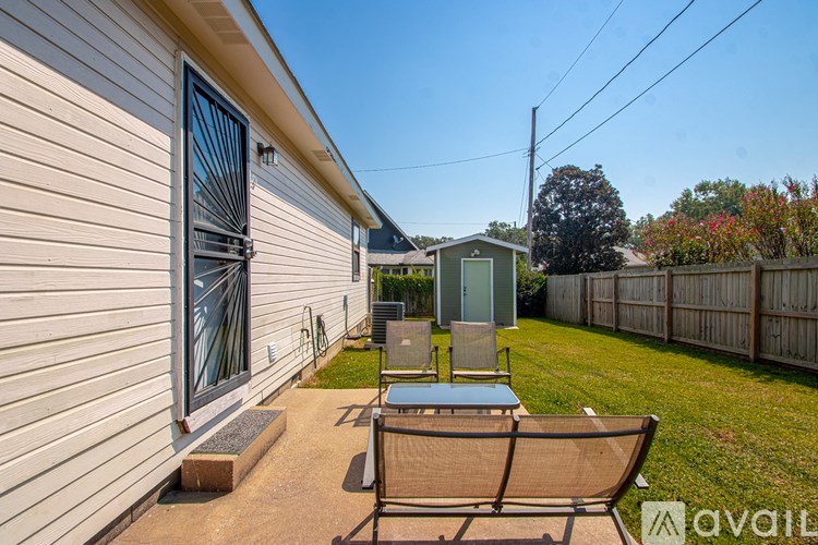 A house with a patio and a chair.
