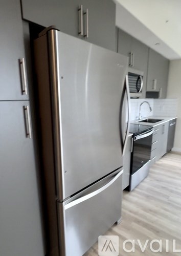 A stainless steel refrigerator in a kitchen.