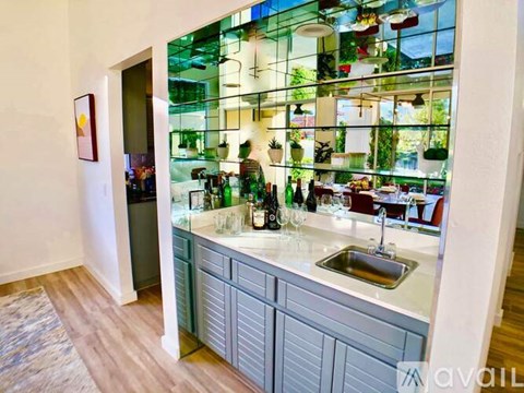 A kitchen with a sink and a window.
