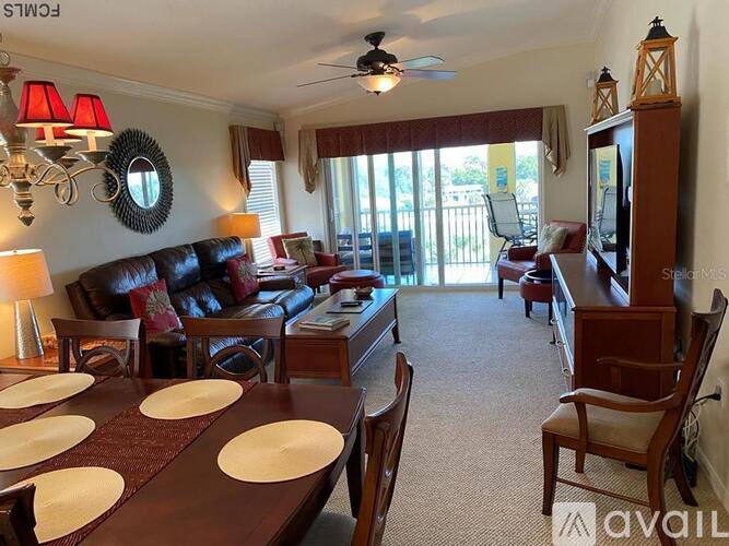A living room with a dining table set for four.