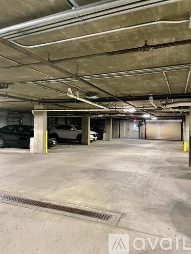 A parking garage with a car parked in the first level.