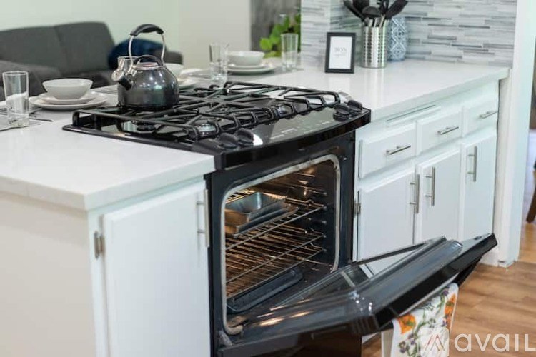A black and white stove with an oven in a kitchen.
