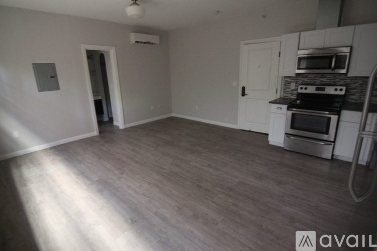 A kitchen with a stove top oven and a microwave.