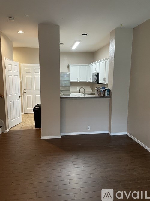 A kitchen area with a sink and cabinets.