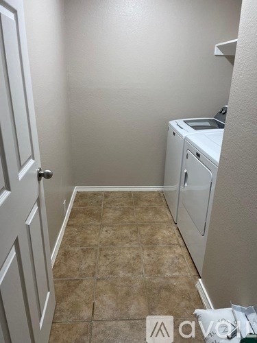 A laundry room with a washer and dryer.
