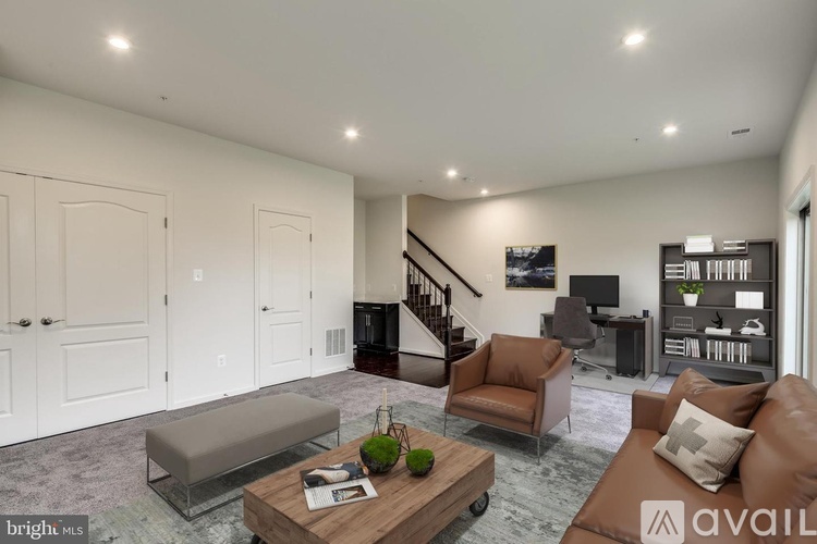 A living room with a couch, chair, and coffee table.