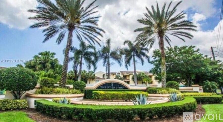 A tropical landscape with palm trees and a sign that says "The St. Regis".