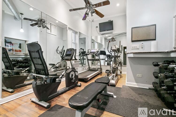 A well-equipped gym with a variety of exercise machines.
