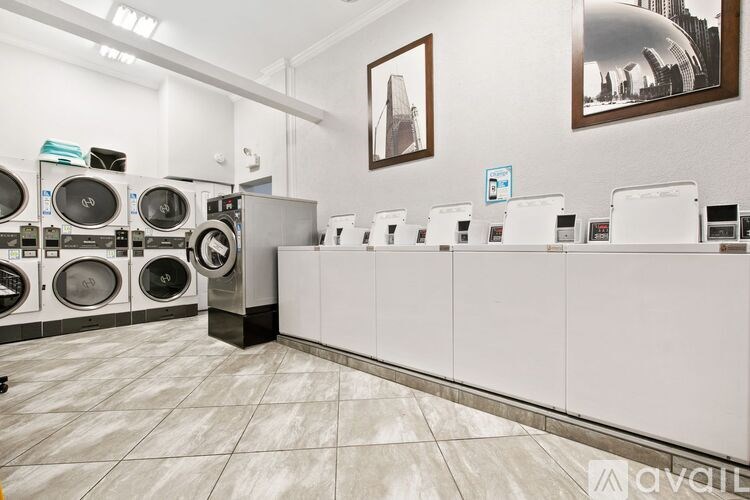 A laundromat with washing machines and dryers.