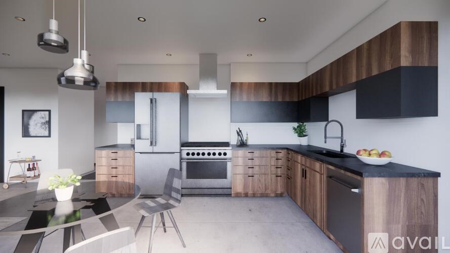 A modern kitchen with a black countertop and wooden cabinets.