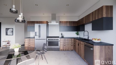 A modern kitchen with a black countertop and wooden cabinets.