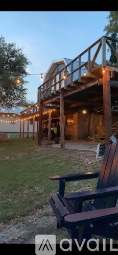 A wooden deck with a bench is shown in the image.