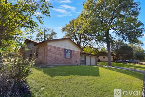 A house with a lawn in front of it.