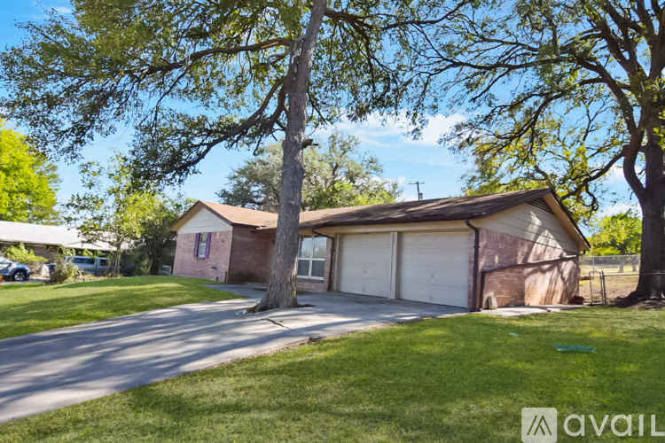 A house with a garage is available for sale.