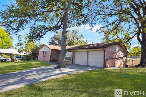 A house with a garage is available for sale.