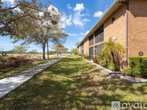 A building with a green lawn in front of it.