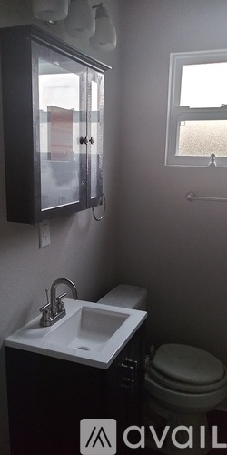 A bathroom with a sink and toilet.