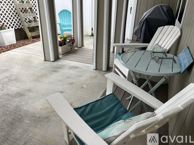 A patio with a table and chairs.