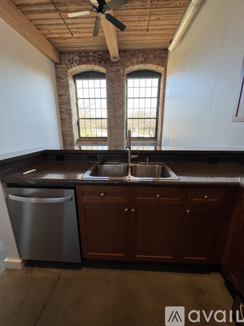 A kitchen with a dishwasher and a sink.