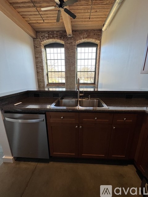 A kitchen with a dishwasher and a sink.