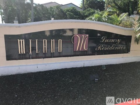 A sign for Milan Residences is displayed on a wall.