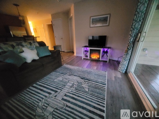 A living room with a fireplace and a couch.