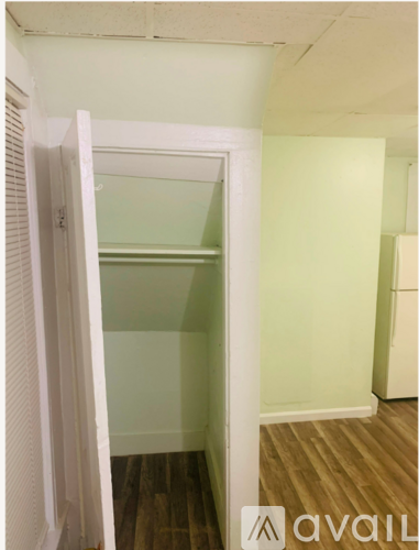 A room with a window and a ceiling with a light color.