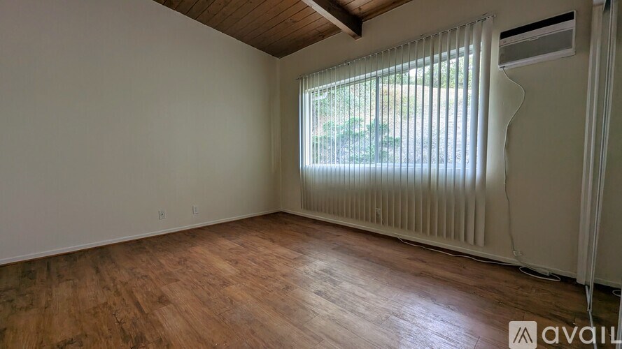 A bathroom with a sink and a window.