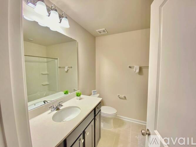 A walk-in closet with shelves and a door.