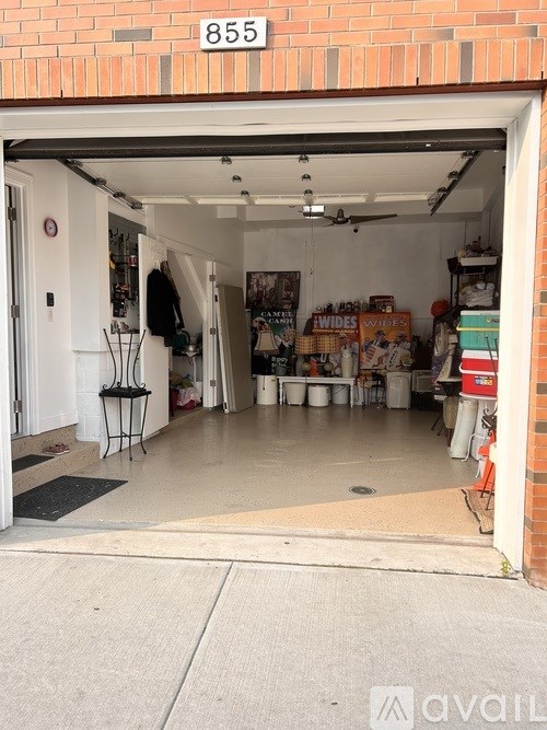 A garage with the number 855 on the wall.