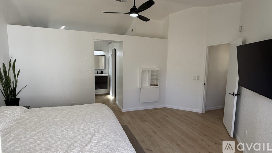 A floor plan of a house with a garage, living room, kitchen, and two bedrooms.