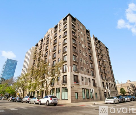 A large, old building with many windows is in the foreground of the image.
