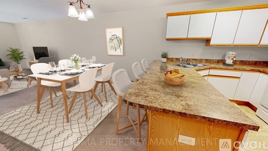 A kitchen with a table and chairs in the middle of the room.