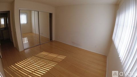 A kitchen with a stainless steel refrigerator and microwave.
