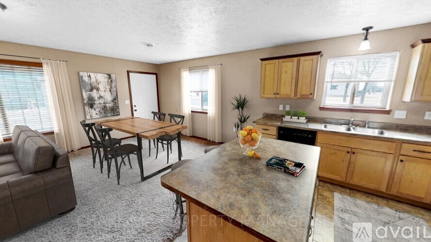 A kitchen with a table and chairs in the middle of the room.