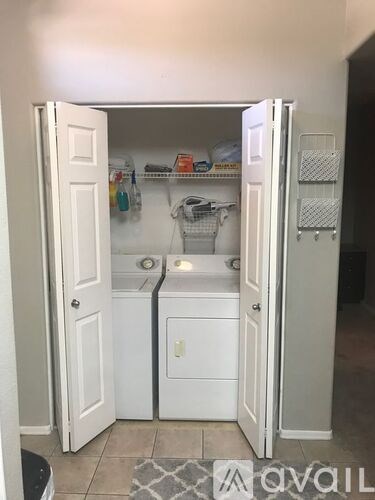 A small kitchen with a sink and a refrigerator.