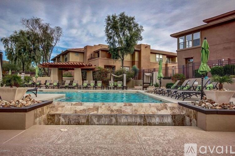 A large house with a pool in the backyard.