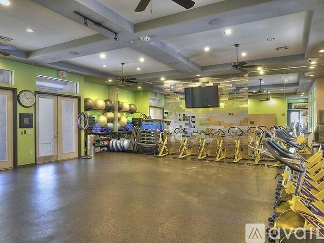 A room with a green wall and a clock on it.