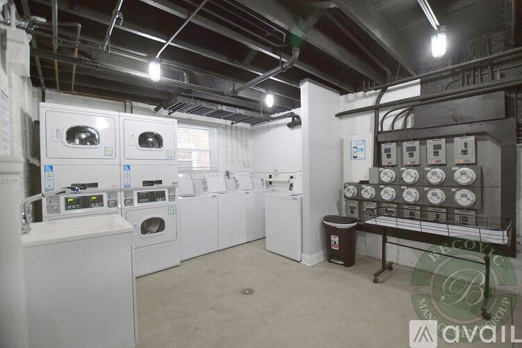 A laundry room with washers and dryers.
